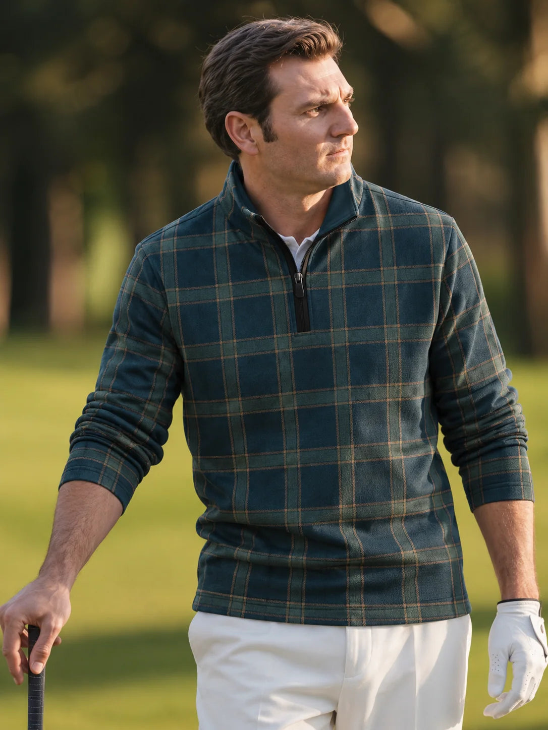 Golf-Pullover aus Funktionsmaterial in tiefem Blaugrün mit klassischem Heritage-Karomuster und Viertelreißverschluss