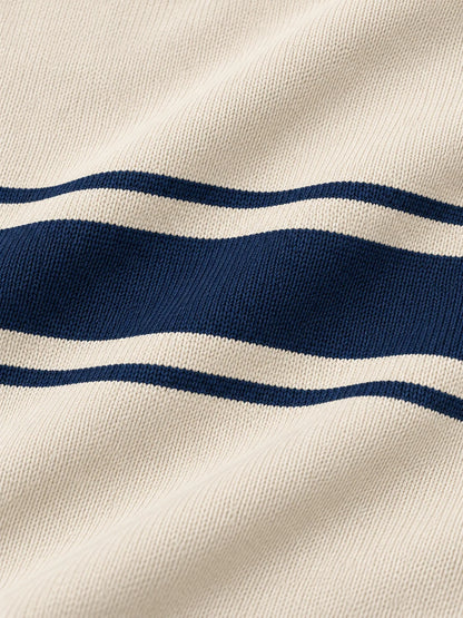 Golfpullover mit Viertelreißverschluss und marineblauem Bruststreifen auf elfenbeinfarbenem Grund, aus Funktionsmaterial