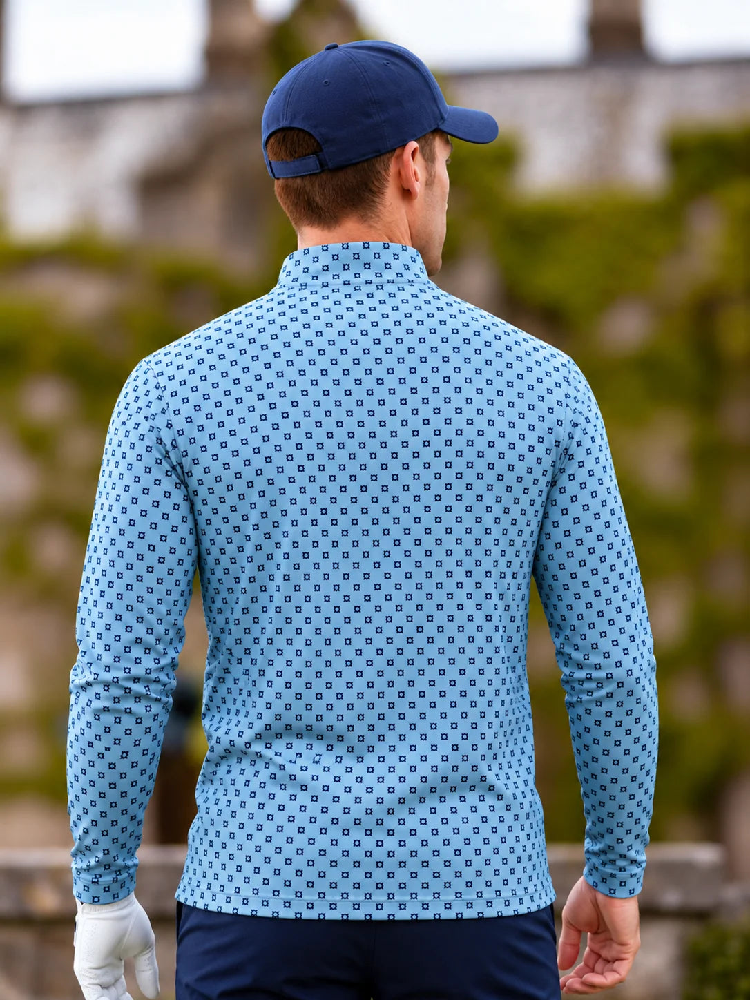 Performance-Golfpullover in Himmelblau mit Blumenmuster und Viertelreißverschluss