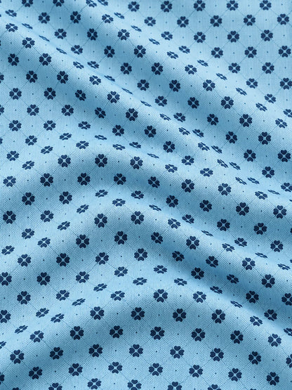 Performance-Golfpullover in Himmelblau mit Blumenmuster und Viertelreißverschluss
