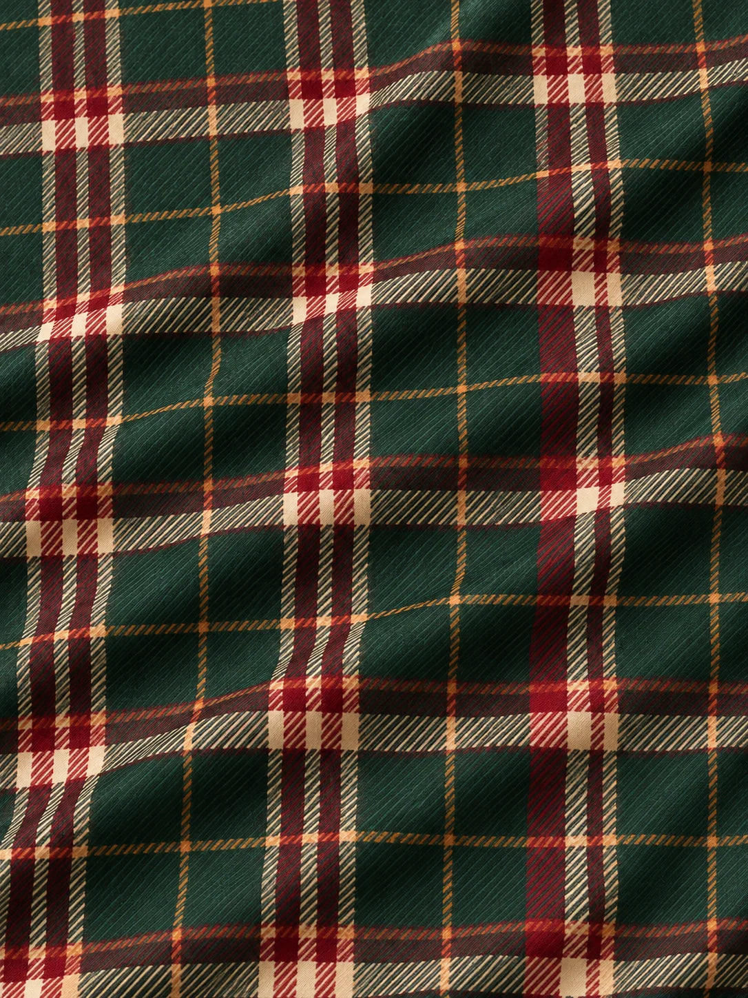 Golfpullover in Tannengrün mit weihnachtlichem Tartanmuster und Viertelreißverschluss