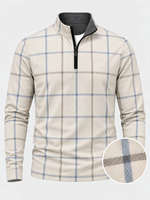Cremefarbener Golfpullover aus Funktionsmaterial mit blauem Karomuster und kurzem Reißverschluss